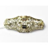 An Italian white metal brooch set with central brilliant cut diamond, approx 0.