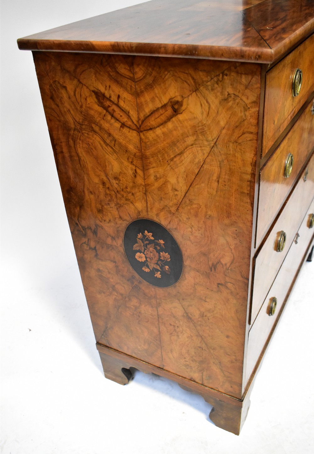 A 19th century walnut chest of four long graduated drawers, raised on bracket feet, - Bild 2 aus 3