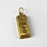 A 9ct gold pendant in the form of an ingot, assay marks to the front, length approx 2.3cm, approx 5.
