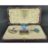 An early 20th century hallmarked silver baby napkin ring and spoon set,