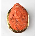 A 19th century carved coral cameo brooch,