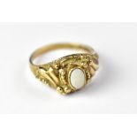 A 9ct gold opal ring, the Victorian-style setting with a small white opal (lacking colour), size Q,