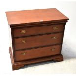 STAG; a mahogany three-drawer chest raised on bracket feet, 74.5 x 82.5 x 46.