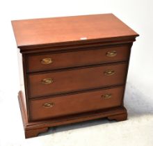 STAG; a mahogany three-drawer chest raised on bracket feet, 74.5 x 82.5 x 46.