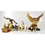 Various ceramic and resin models of owls and other animals,