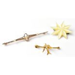 A 15ct gold bar brooch set with seed pearl in an open platinum flowerhead setting,