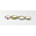 Four 9ct gold dress rings comprising three opals separated by four white stones, size Q,