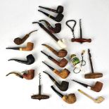 A collection of 19th and early 20th century pipes to include clay and briarwood examples,