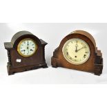 A 1940s oak dome topped mantel clock, the silvered chapter ring set with Roman numerals,