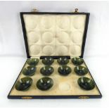 A late 19th/early 20th century set of eleven Chinese spinach jade circular bowls,