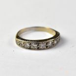 A large white gold and diamond eternity ring with nine graduated pavé set diamonds, total approx 0.