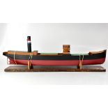 A scratch built model of a cargo ship with funnel in red, white and blue, length 104cm,