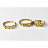 Three 9ct gold rings comprising one in the Claddagh style, size N, one inscribed 'Nan',