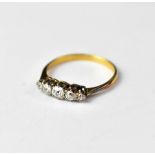 An 18ct gold ring with five claw set graduated brilliant cut diamonds,