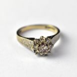 A vintage 18ct white gold diamond cluster ring,