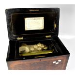 A Victorian walnut cased music box with six bells and two drums, playing a selection of waltz music,