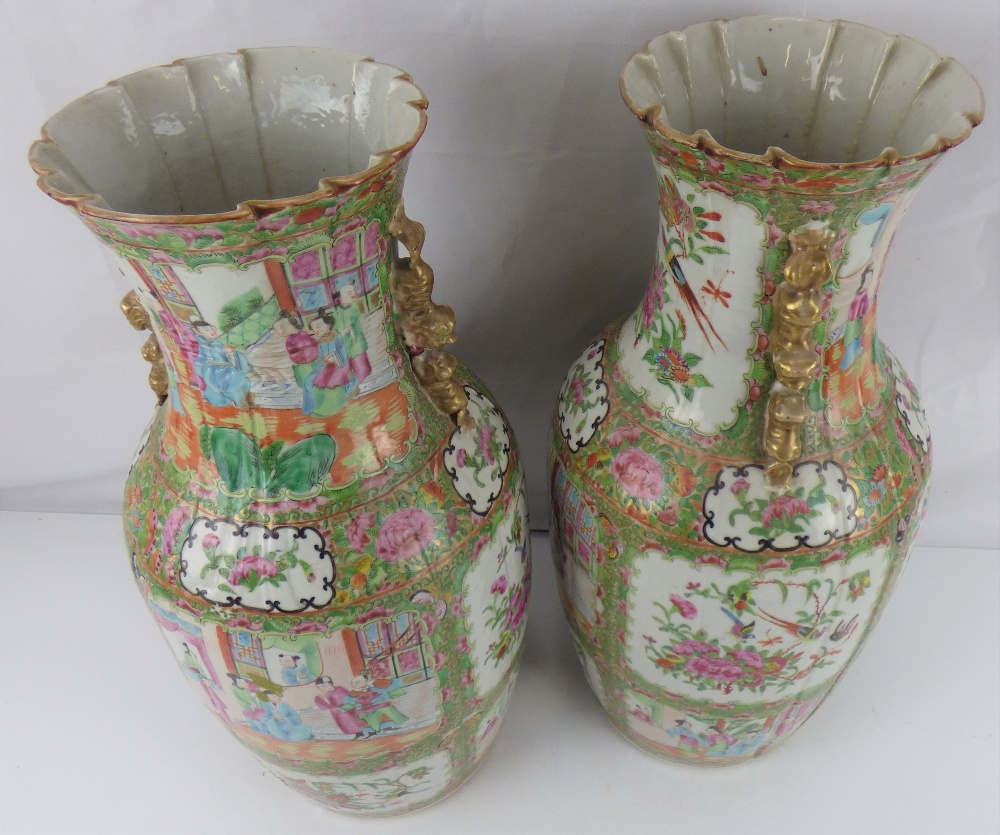 A pair of late 19th century Canton Famille Rose vases with all-over decoration, unmarked, - Bild 2 aus 2