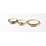 Three gold rings comprising a large 9ct gold example with tiny illusion set diamond, size W,