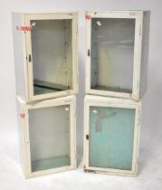 Four white metal industrial wall-hanging units with glazed cupboard doors, each 74 x 49 x 29cm (4).