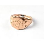 A 19th century 9ct rose gold ring with initials 'MBS' to the top, with cut shank, size approx M,