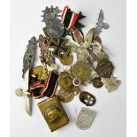 A quantity of WWII German medals, cap badges, etc, including Third Reich items, Iron Cross,