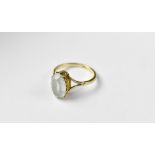 A 9ct gold ring with oval light blue stone, with split shoulders, size O, approx 2.6g.