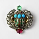 An Art Deco Egyptian-style brooch in the form of a winged scarab,