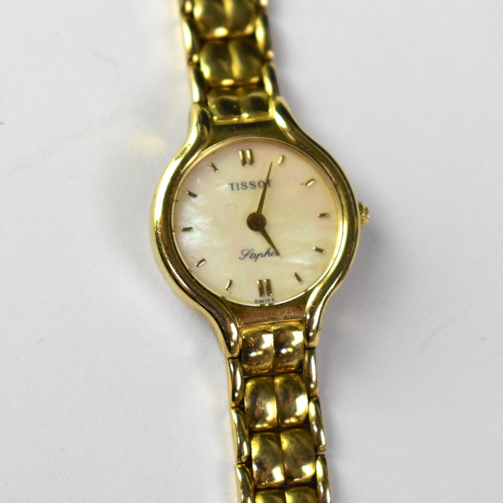 TISSOT; a ladies' 9ct gold wristwatch, the pearlescent dial set with raised gold baton numerals, - Bild 2 aus 2