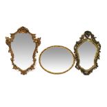 A gilt framed Rococo-style shaped wall mirror and two similar examples (3).