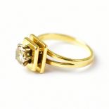 A yellow metal ring set with a solitaire brilliant cut diamond, in a six-claw setting, approx 0.