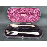 An Edwardian hallmarked silver spoon and fork set with bright cut decoration, Walker & Hall,