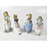 NAO; four figures of girls, comprising one holding a puppy, one doing needlework,