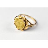 A 9ct gold ring set with an 1865 Mexican small gold coin with the head of Maximiliano,