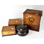 A mahogany box with lift-up front cover with wreath motifs,