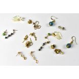 Ten pairs of gold and other earrings, to include mother of pearl doves, green jade-style studs,