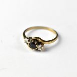 A 9ct gold diamond and sapphire ring,