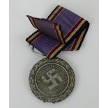 A WWII German Air Defence Medal with ribbon.
