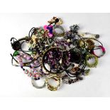 A quantity of costume jewellery to include bracelets, etc.