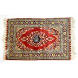 A Persian designed red ground rug, width 152cm and a small Persian designed floral rug,