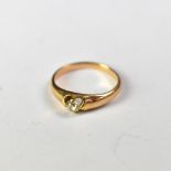 A yellow gold diamond ring with small tension set diamond, size H, approx 2g, unmarked.