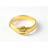 A late 19th/early 20th century 22ct gold buckle ring, size O, approx 5g.