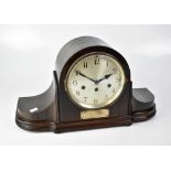 A mahogany Napoleon hat mantel clock, the silvered dial set with Arabic numerals,