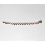 A 9ct rose gold oval link bracelet with hoop fastener and swivel clasp, length approx 22cm,