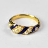An early 19th century blue enamelled and seed pearl ring with diagonal lines of graduated seed