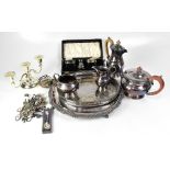 A quantity of silver plated ware to include a cased part cruet set, a four-piece tea set, trays,