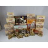 Eleven boxed David Winter cottages including 'Fred's Home', 'Squire's Hall', 'Guy Fawkes',
