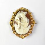 A 19th century large carved shell cameo brooch, the central cameo depicting Leda and the Swan,