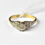 An 18ct gold ring with an illusion set diamond in a platinum head, size N, approx 2.6g.