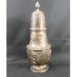 A William IV hallmarked silver large sugar caster with flame finial, pierced lid,
