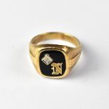 A 10ct (10k) gold signet ring with cushion-shaped black onyx,